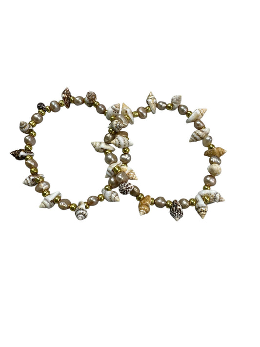 Bracelet made with Shells and gold round beads