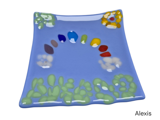 Colorful light blue wavy glass with colorful dots in a shape of rainbow and flowers.