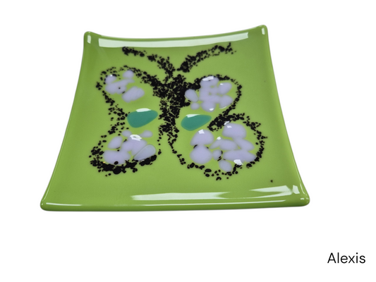 Colorful light green glass plate with a shape of a butterfl