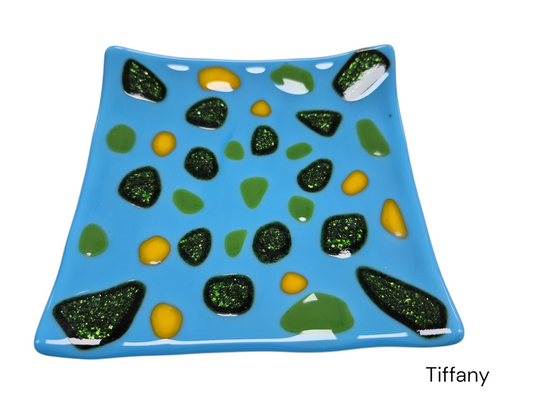 Wavy light blue glass plate with green glitter dots and yellow dots