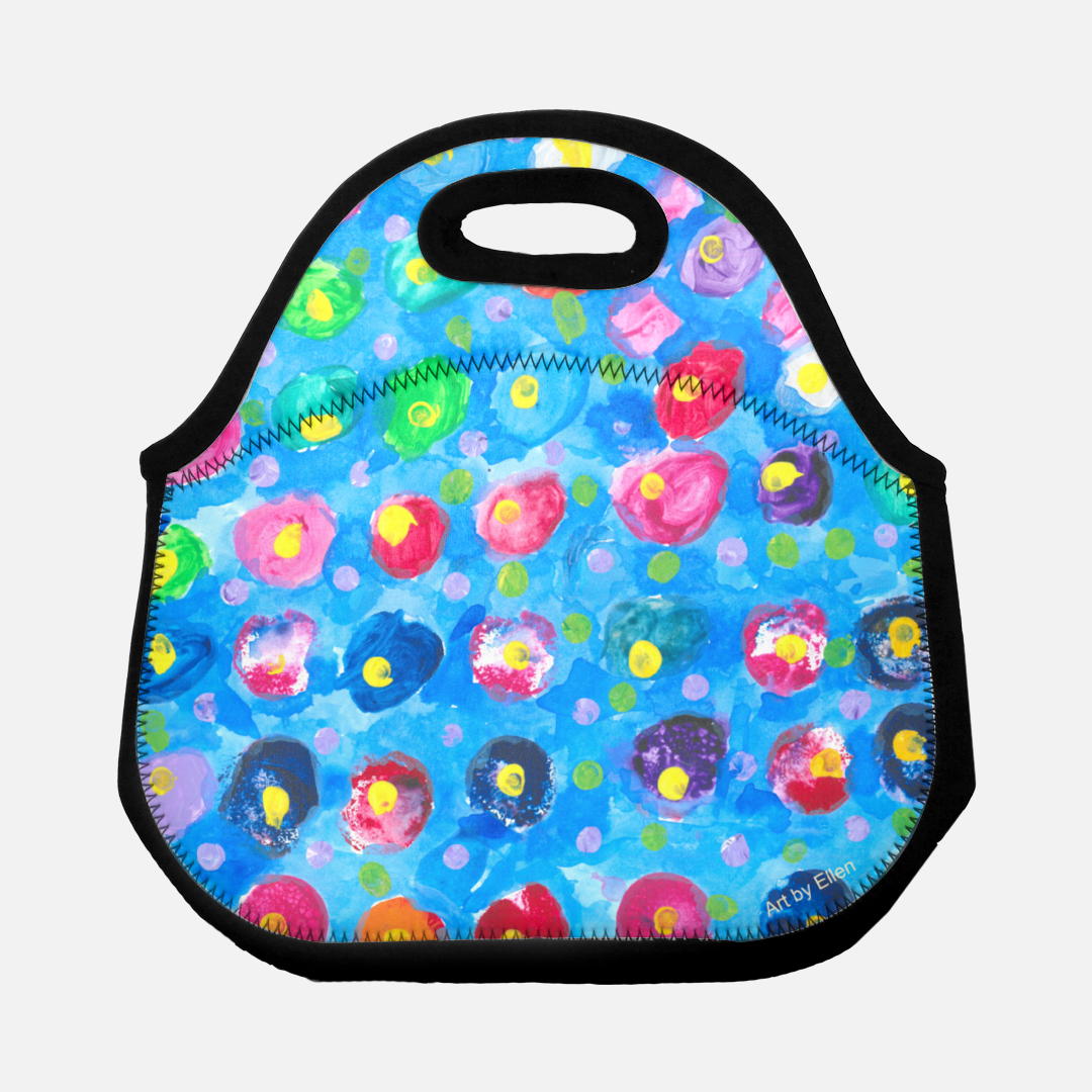This is a lunchbag with a blue background and multicolored dots with yellow centers. The colors include: purple, pink, orange, and blue.