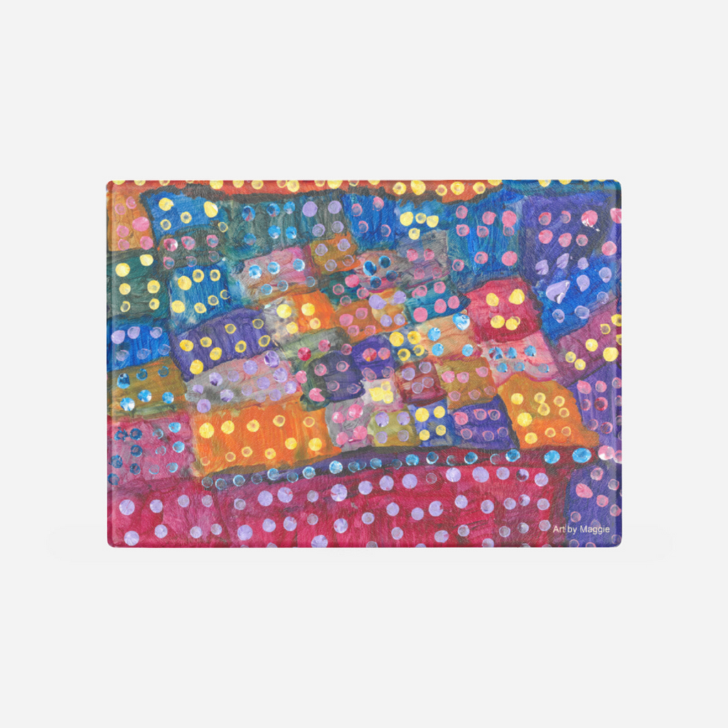 This is a cutting board with the following painting on it: This is a multicolored painting with several boxes of colors including red, orange, blue, purple and yellow. There are multicolored dots covering the page