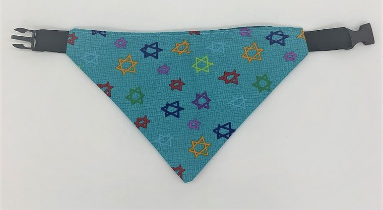 Light blue dog bandana with yellow, purple, blue, green, and red Jewish stars