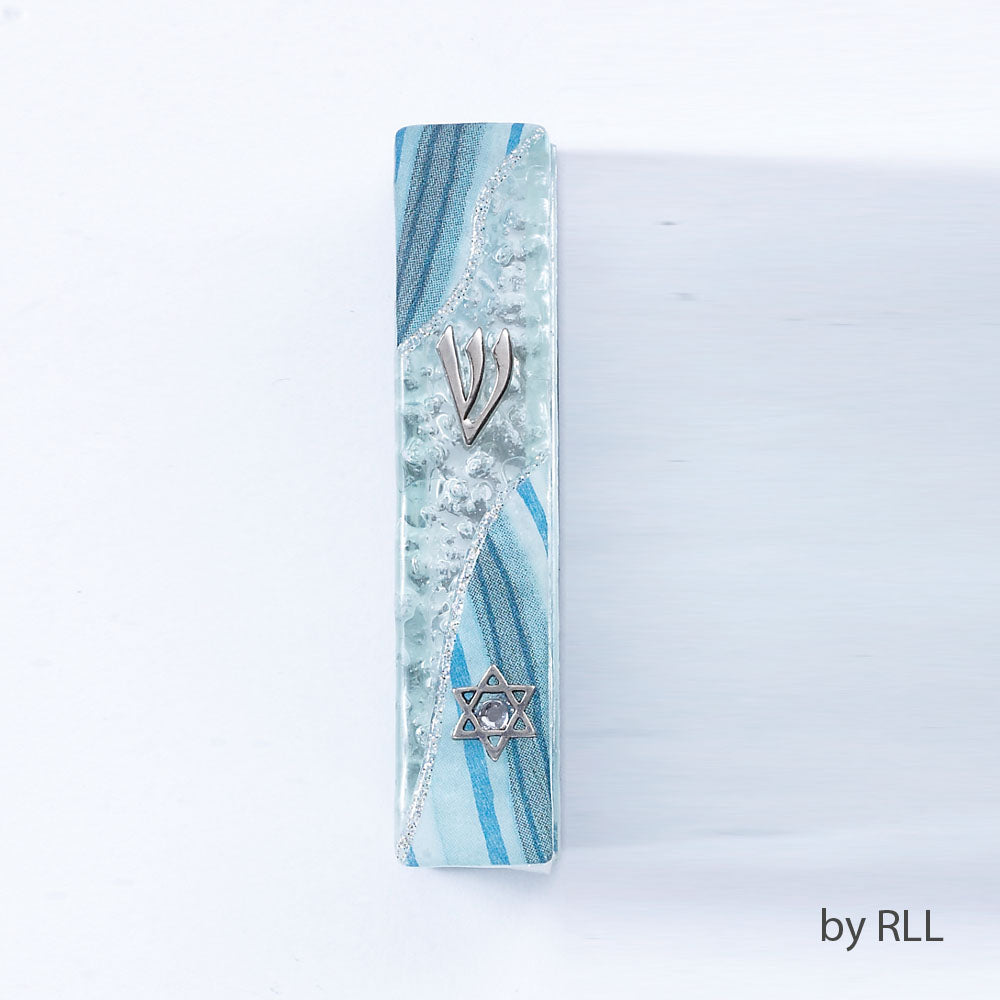 Glass mezuzah with silver Jewish star and light blue ribbons and sparkles running length wise