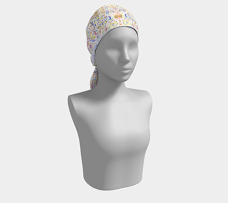 Mannequin wearing white head scarf with free form shapes of blue, purple, green, yellow, orange and red colors