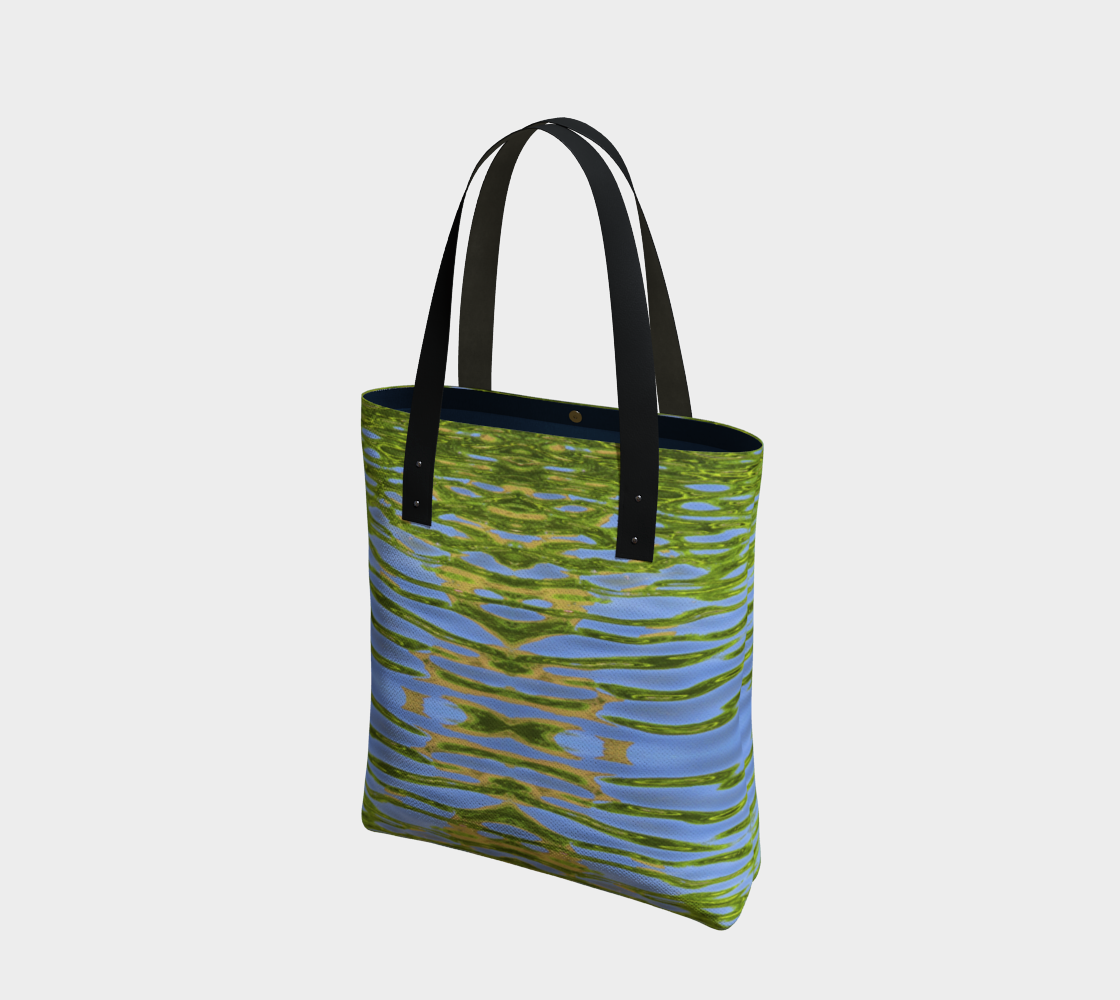 Lined Tote bag with vegan black leather straps and a magnetic clasp. The pattern is of reflecting water and leaves