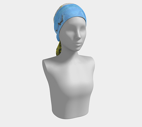 Mannequin wearing blue head scarf depicting yellow house with smiling sun above, black bird, green grass and a fence