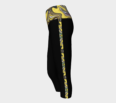 Side view of Black yoga capris with top band and side stripes depicting yellow, gold, green, pink swirl design