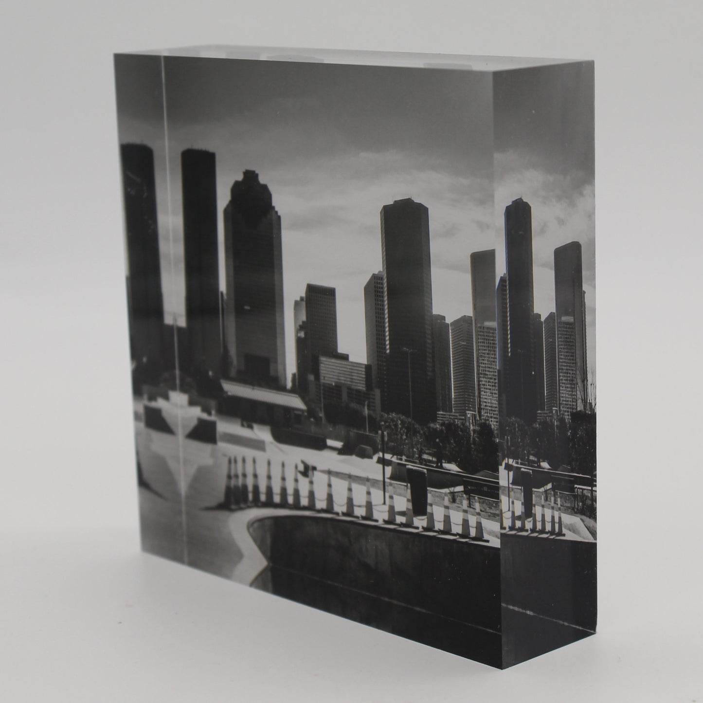 Tilted view of Acrylic block depicting black and white photo of Houston skyline