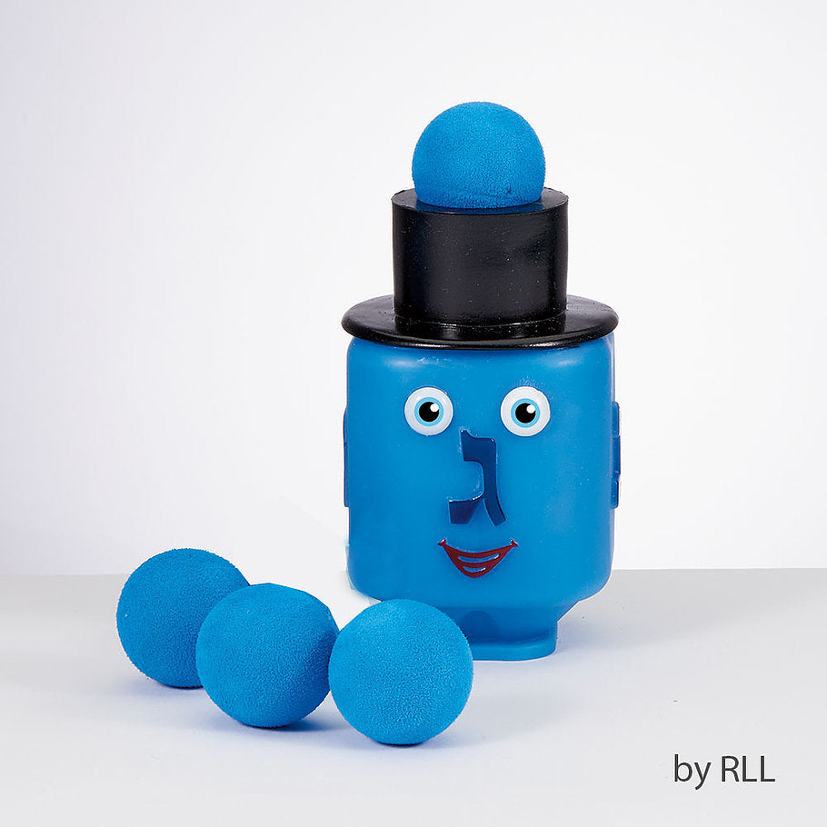Blue dreidel with face and black top hat which can pop small blue foam balls from the hat
