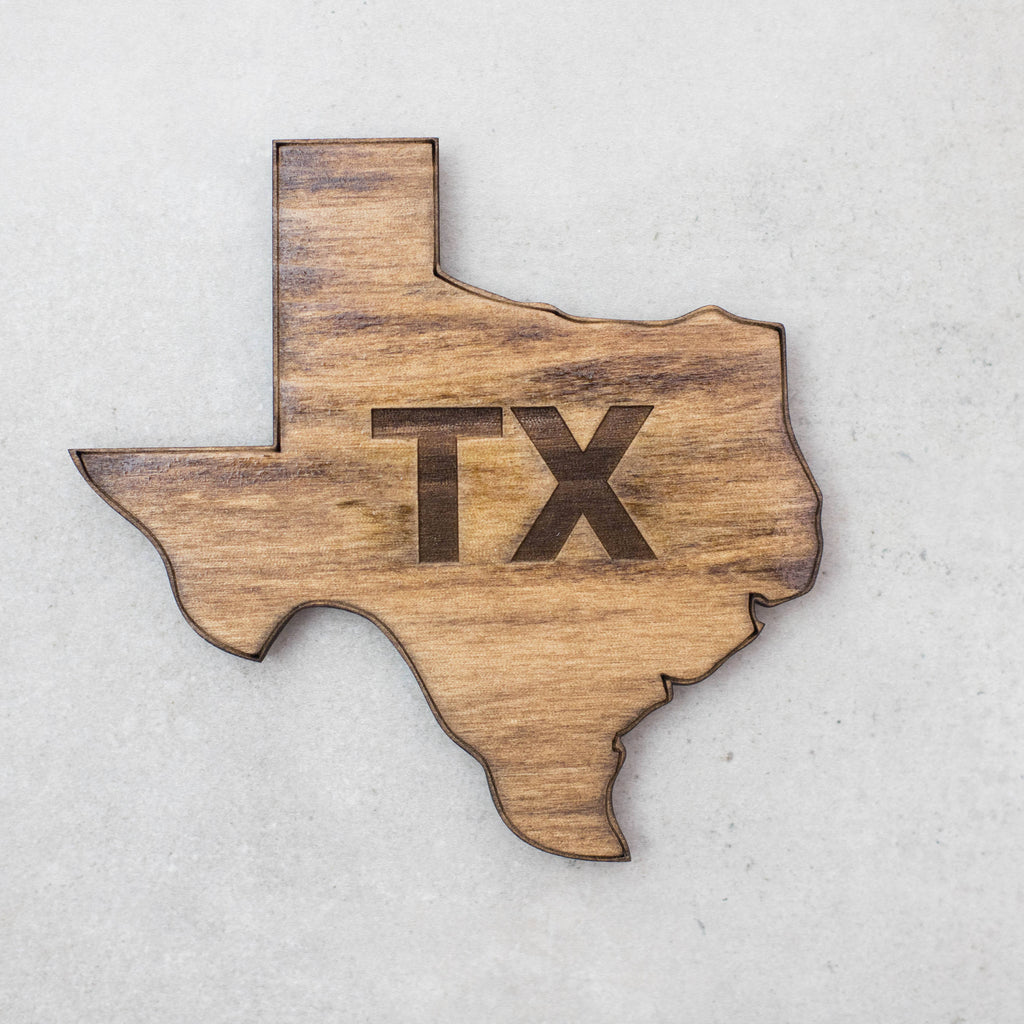 Texas shaped coasters in dark stain with laser cut TX in the center