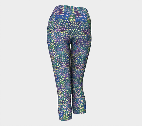 Back view of Yoga capri leggings with blue, green and purple swirl background with yellow, green and pink dots
