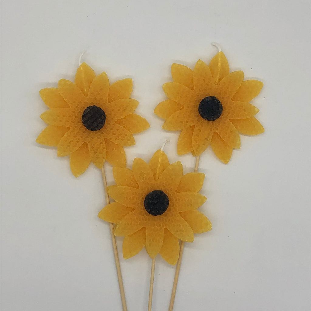 Three large yellow sunflower beeswax candles 