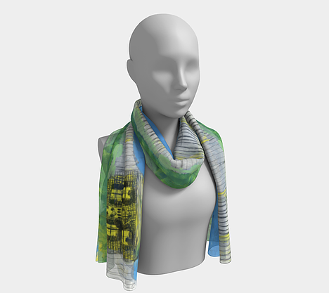 Mannequin wearing blue neck scarf depicting yellow house with smiling sun above, black bird, green grass and a fence
