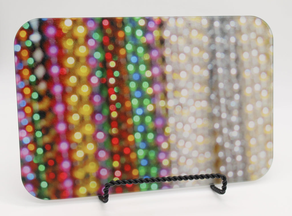 Glass cutting board with close up view of bead strands