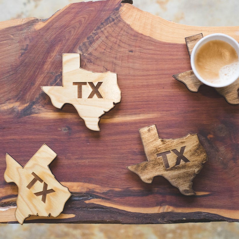 Texas shaped coasters in light and dark stain with laser cut TX in the center