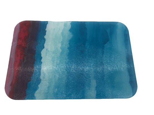 Rectangular glass cutting board with pink, red, dark blue and light blue gradient from left to right