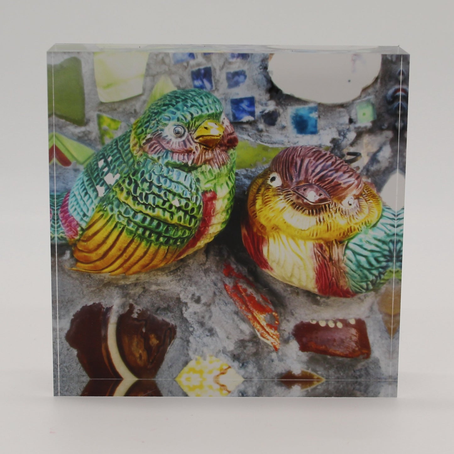 Acrylic block depicting two colorful birds