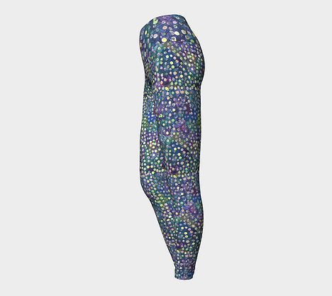 Side view of Yoga leggings with blue, green and purple swirl background with yellow, green and pink dots