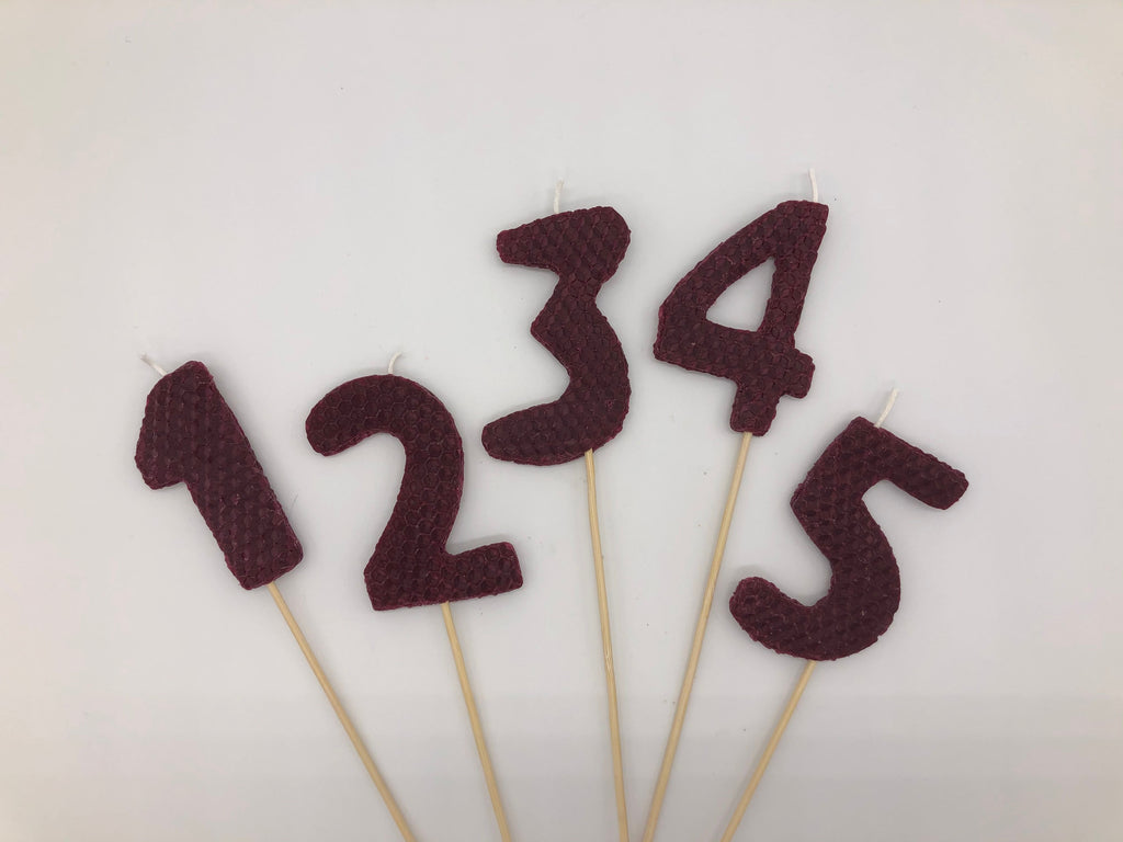 Large maroon beeswax candles, number 1, 2, 3, 4 and 5