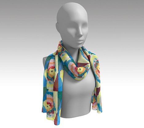 Mannequin wearing a colorful scarf with circle within circle design with blue, green, orange, pink, yellow and red colors