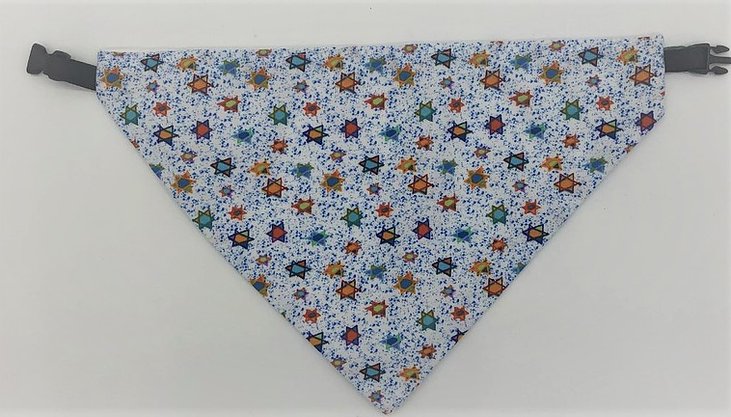 White dog bandana with tiny blue dots and blue, green, orange, and red Jewish stars