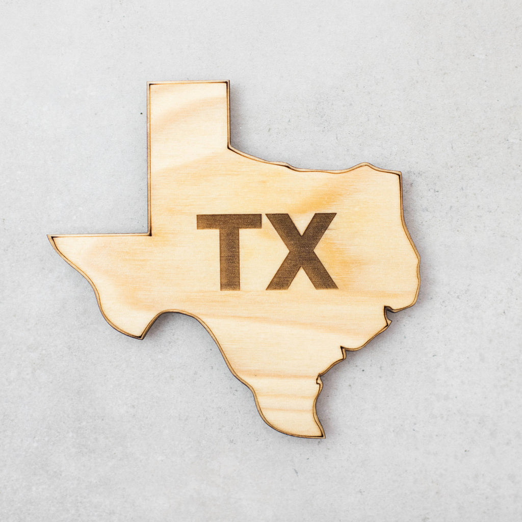 Texas shaped coaster in light stain with laser cut TX in the center