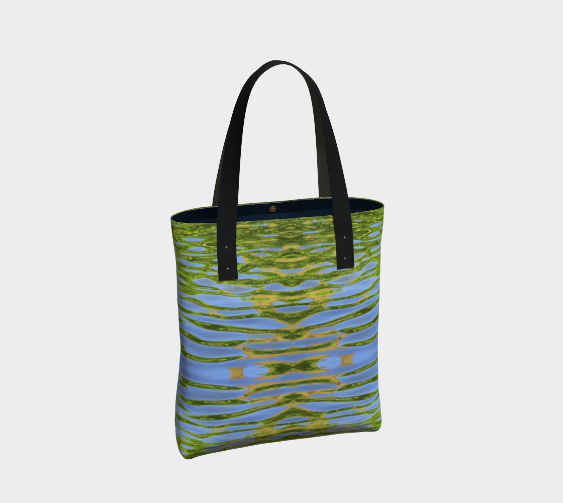 Lined Tote bag with vegan black leather straps and a magnetic clasp. The pattern is of reflecting water and leaves