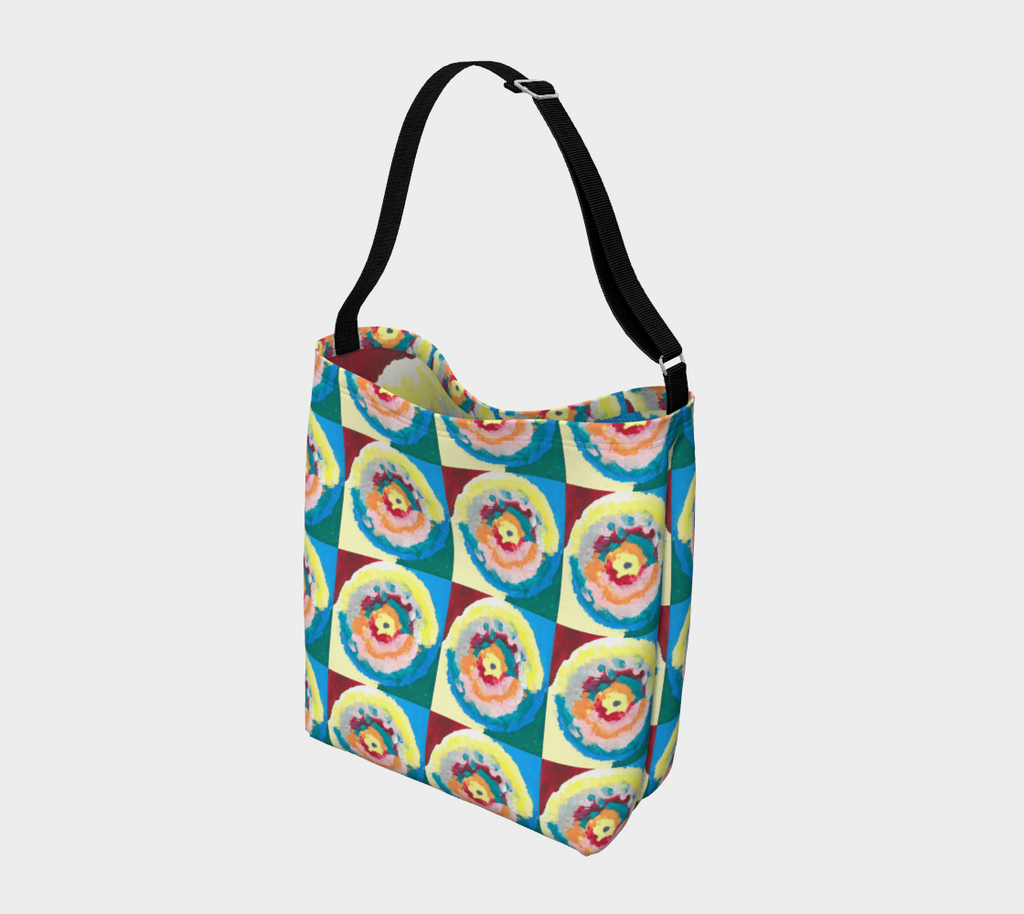 Crossbody purse with black strap and colorful circle within circle design with blue, green, orange, pink, yellow and red colors