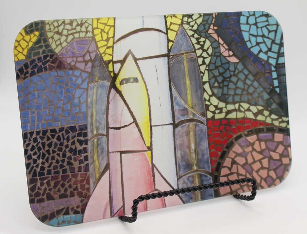 Glass cutting board of colored mosaic tiles depicting space shuttle