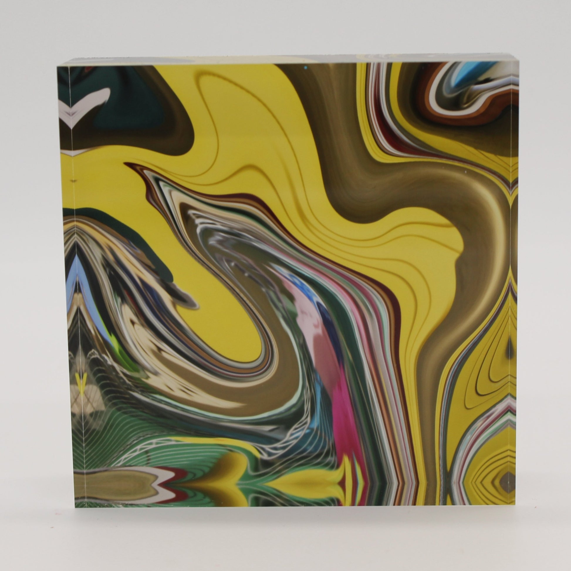 Acrylic block with swirling design of yellow, gold, green, pink swirl
