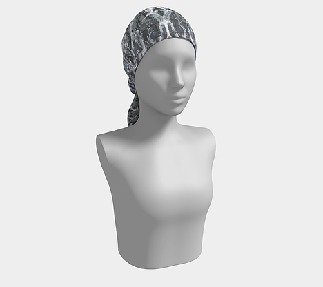 Mannequin wearing gray, white and black head scarf with running water design