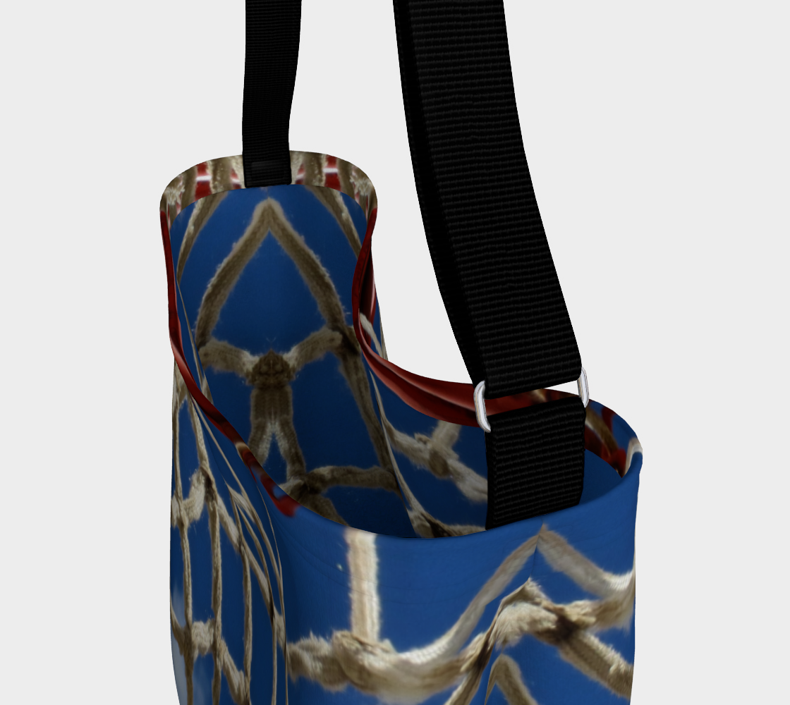 Close up view of Crossbody totebag with single black strap with blue background and close up view of white basketball netting and red basketball rim