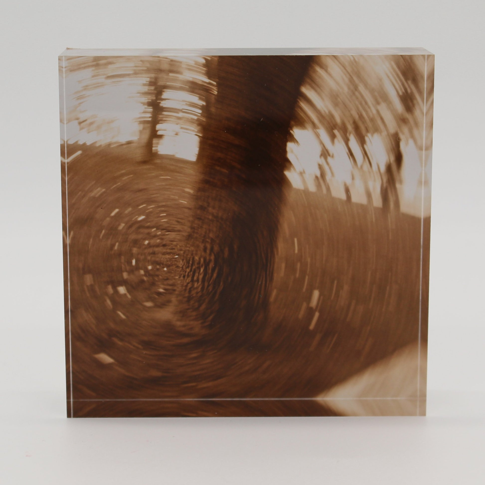 Acrylic block depicting tree trunk in motion