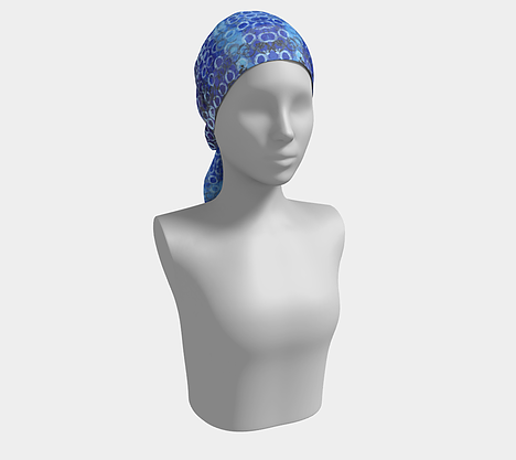 Mannequin wearing head scarf with gradient blue background with white and black circles overlaid