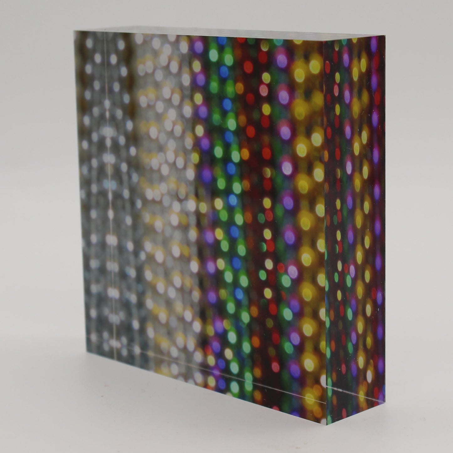 Tilted view of Acrylic block depicting close up view of bead strands