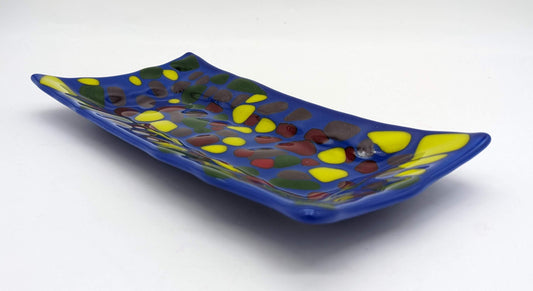 glass blue rectangular tray with yellow, red, and green dots all over