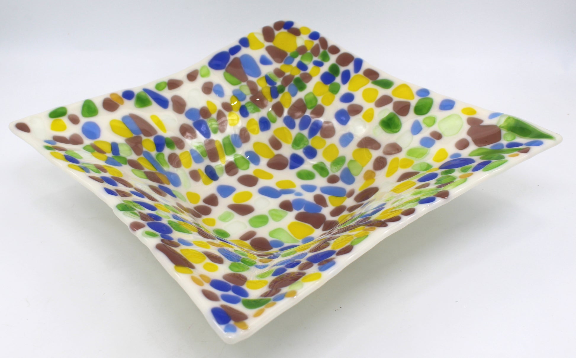 off white glass square bowl with specs of yellow, purple, green, and blue