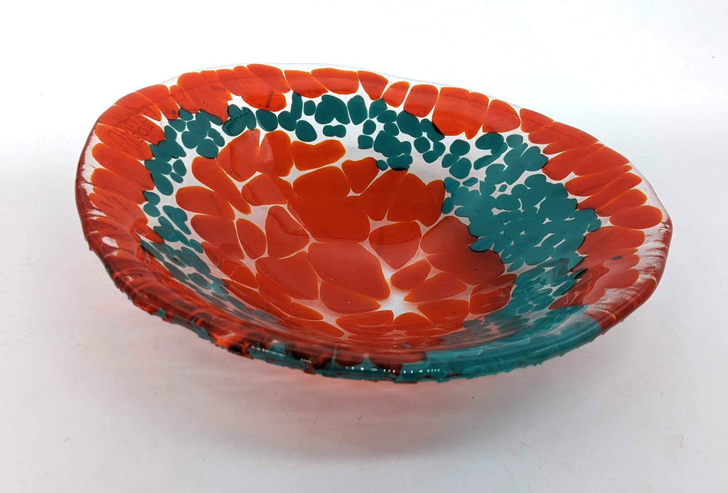 Clear glass bowl with an orange rim and center, with turquoise in between