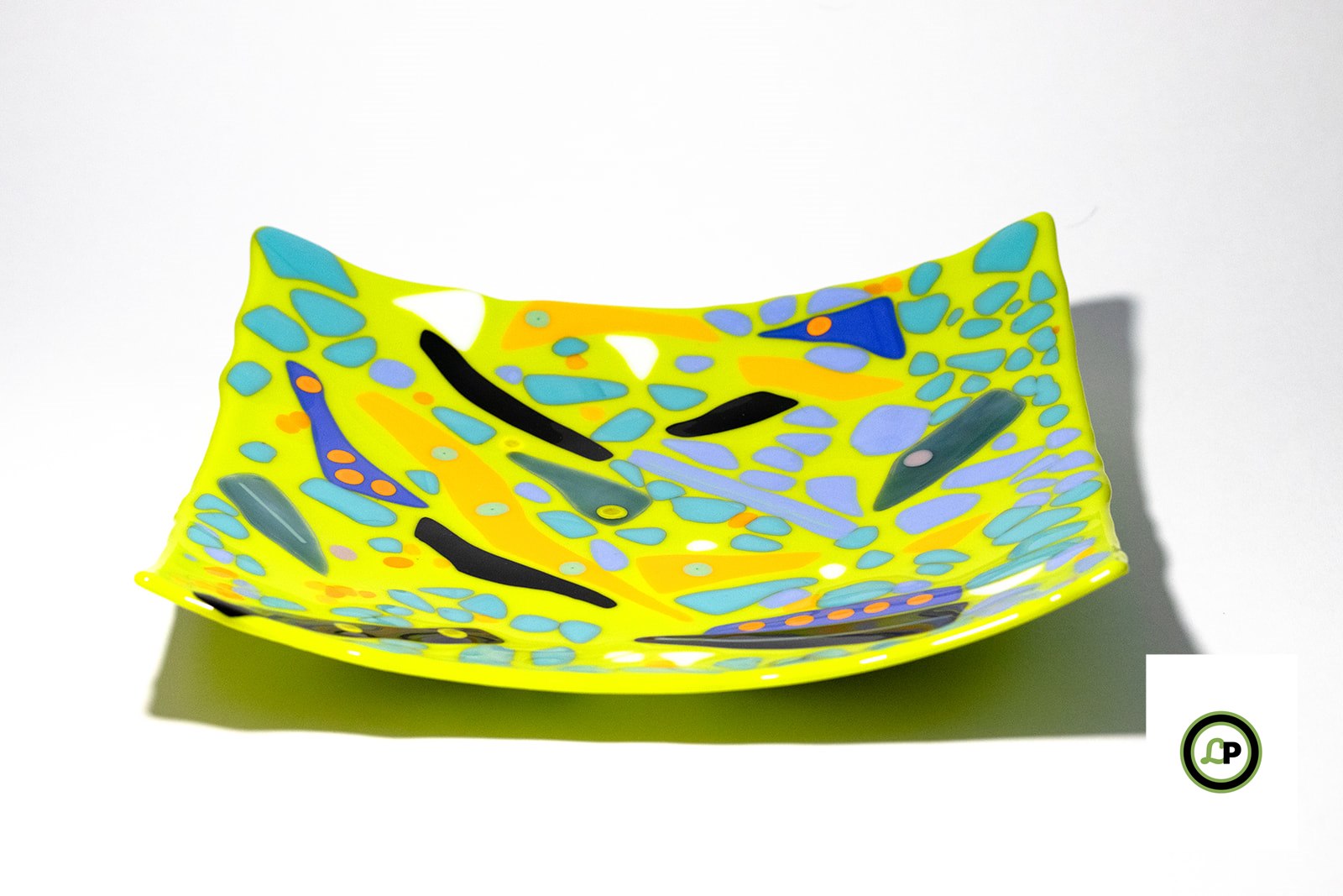 lime green glass plate with dots on top