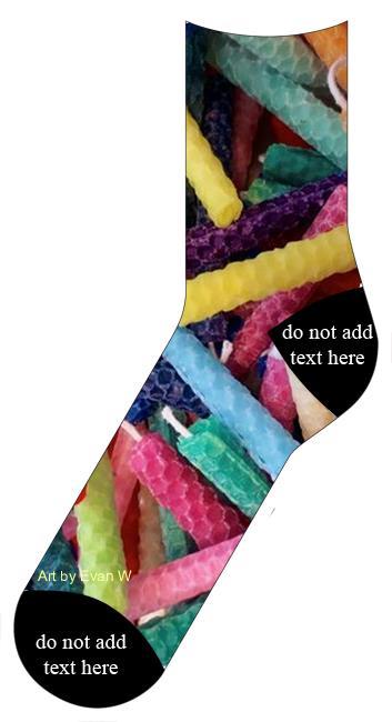 This is a pair of socks with multicolored candles including pink, blue, purple, yellow green, orange.