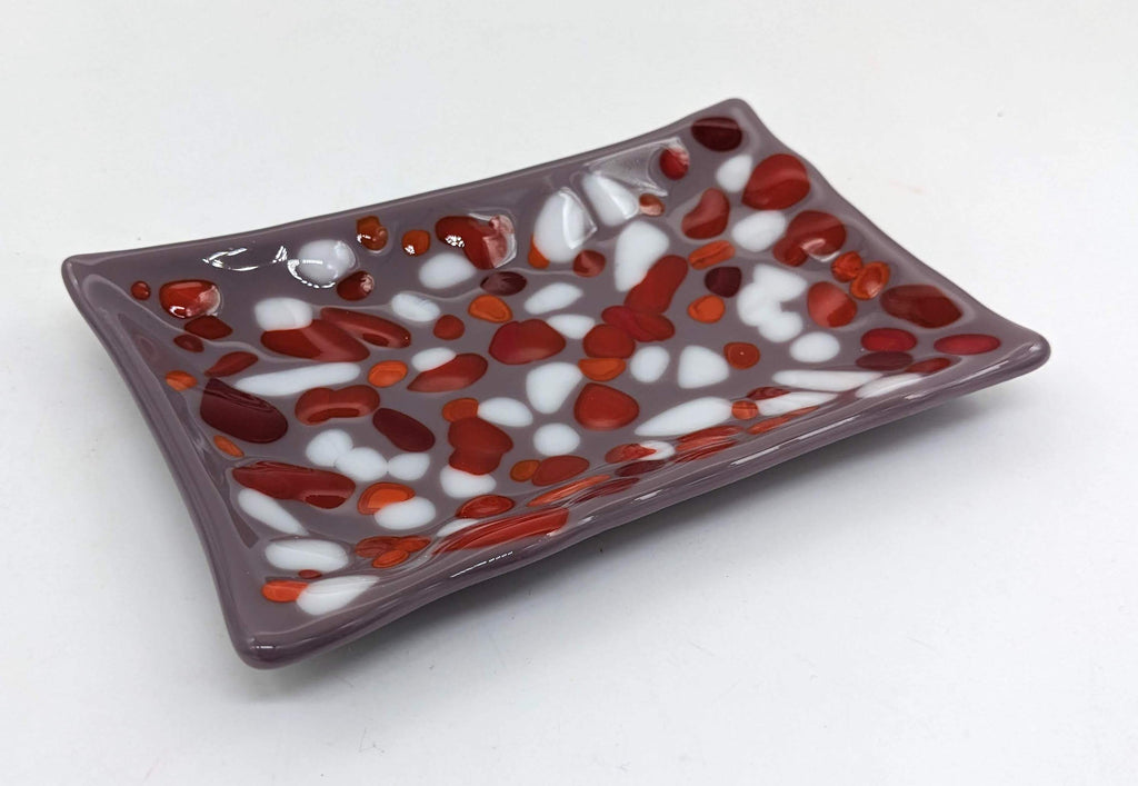 purple soap dish with red and white