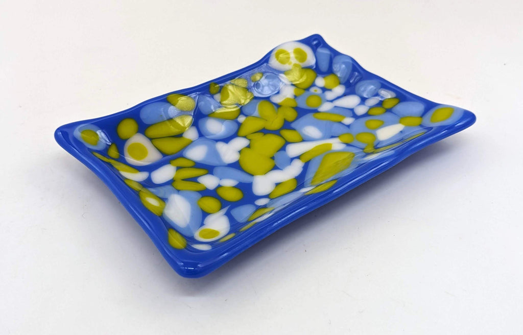 blue soap dish with blue , green, and white