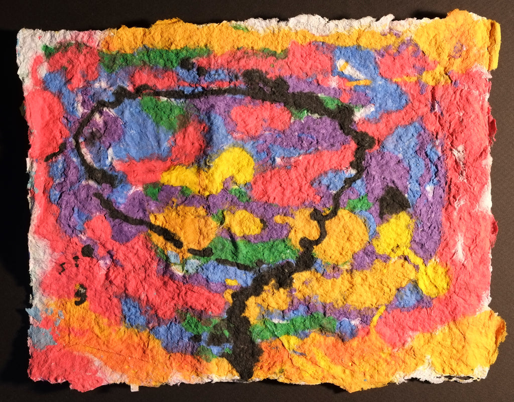 Pigment on recycled paper artwork with yellow, green, red, blue and purple background with a black circle in the center