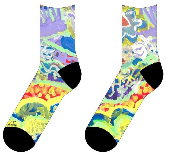 Socks with Painting with various patterns in each section. The background is mostly of purples and blues with curved sections painted with a light green. In between each section a different pattern is painted in either a light yellow or white. Some of the patterns include dots and stars. At the bottom of the painting is an outline of a flower, butterfly, and zigzags.