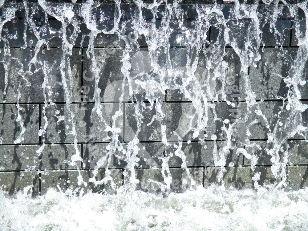 Gray, white and black artwork depicting running water