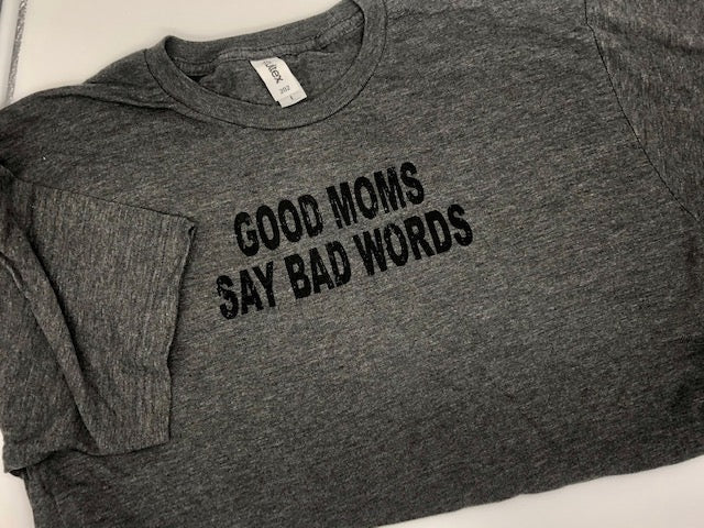 grey t-shirt and black wording