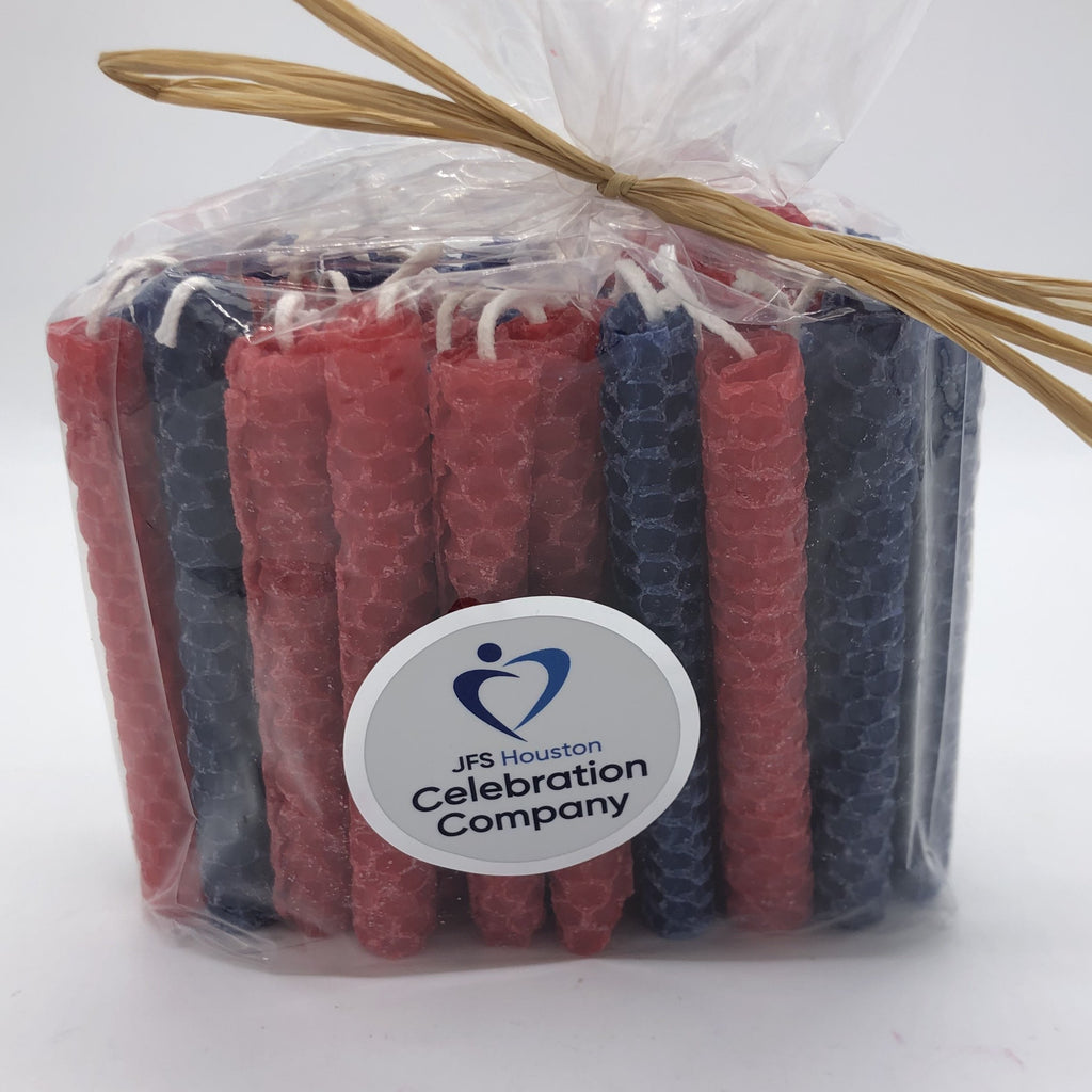 Package of 44 Chanukah candles in red and navyblue.  The package is tied with raffia on top and has a white logo sticker on the front.
