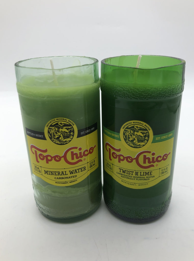 Cut clear and green bottles of Topo Chico with light green candle inside.
