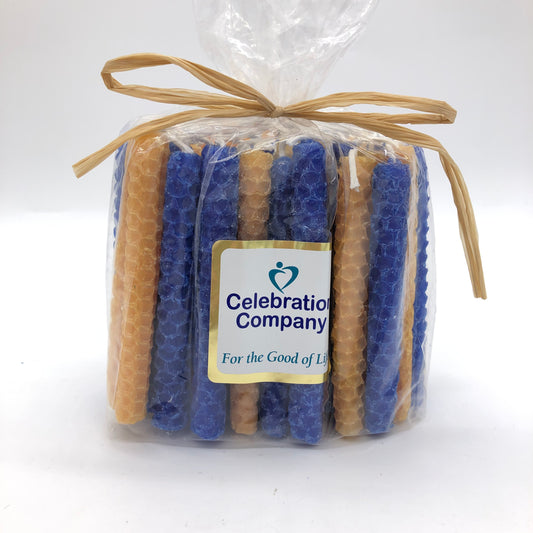 Package of 44 Chanukah candles in Astros colors, orange and electric blue.  The package is tied with raffia on top and has a white logo sticker on the front.